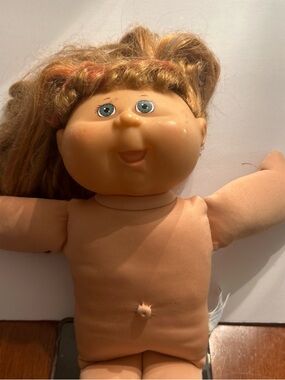 Classic Blonde-Haired Cloth Baby Doll in Peach Body